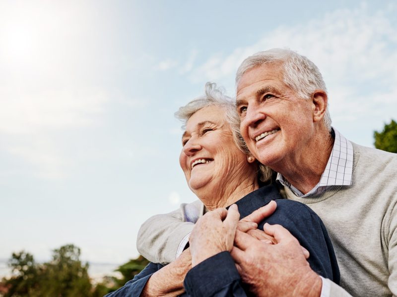 Sky,,Elderly,Couple,And,Hug,Outdoors,Or,Happy,In,Retirement